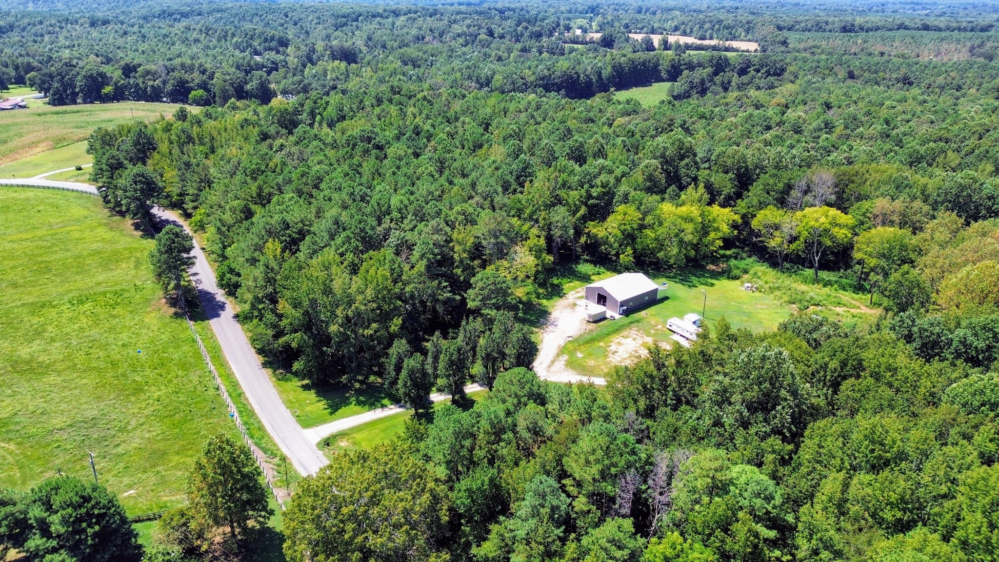 1240 Johnson Branch Road Pulaski, TN 38478 - Photo 10 of 68 an aerial view of residential house with outdoor space and trees all around