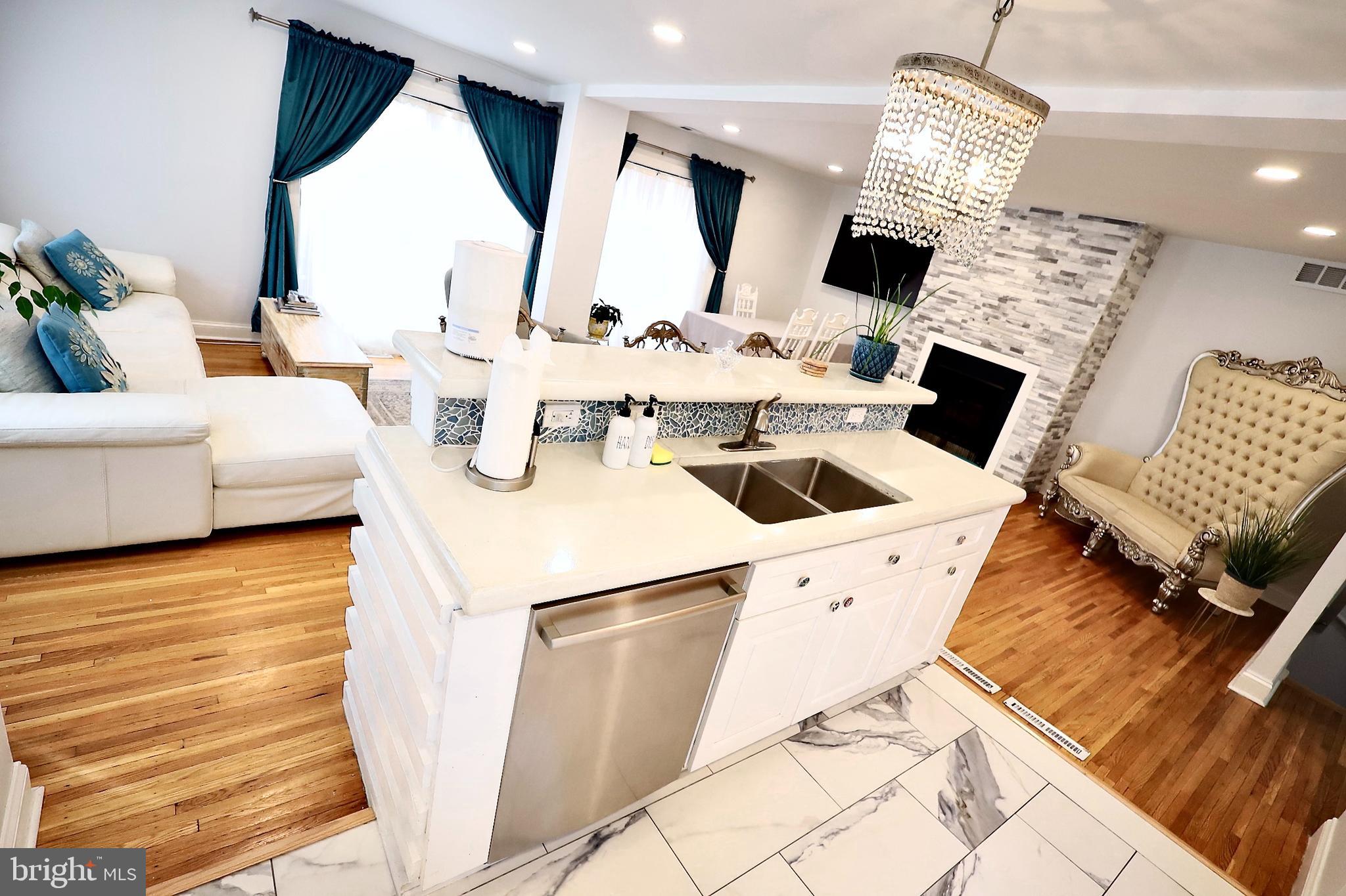 701 Lombard Street Philadelphia, PA 19147 - Photo 12 of 59 a living room with furniture and a fireplace