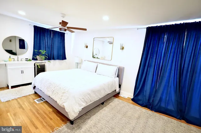 a bedroom with a bed and a dresser