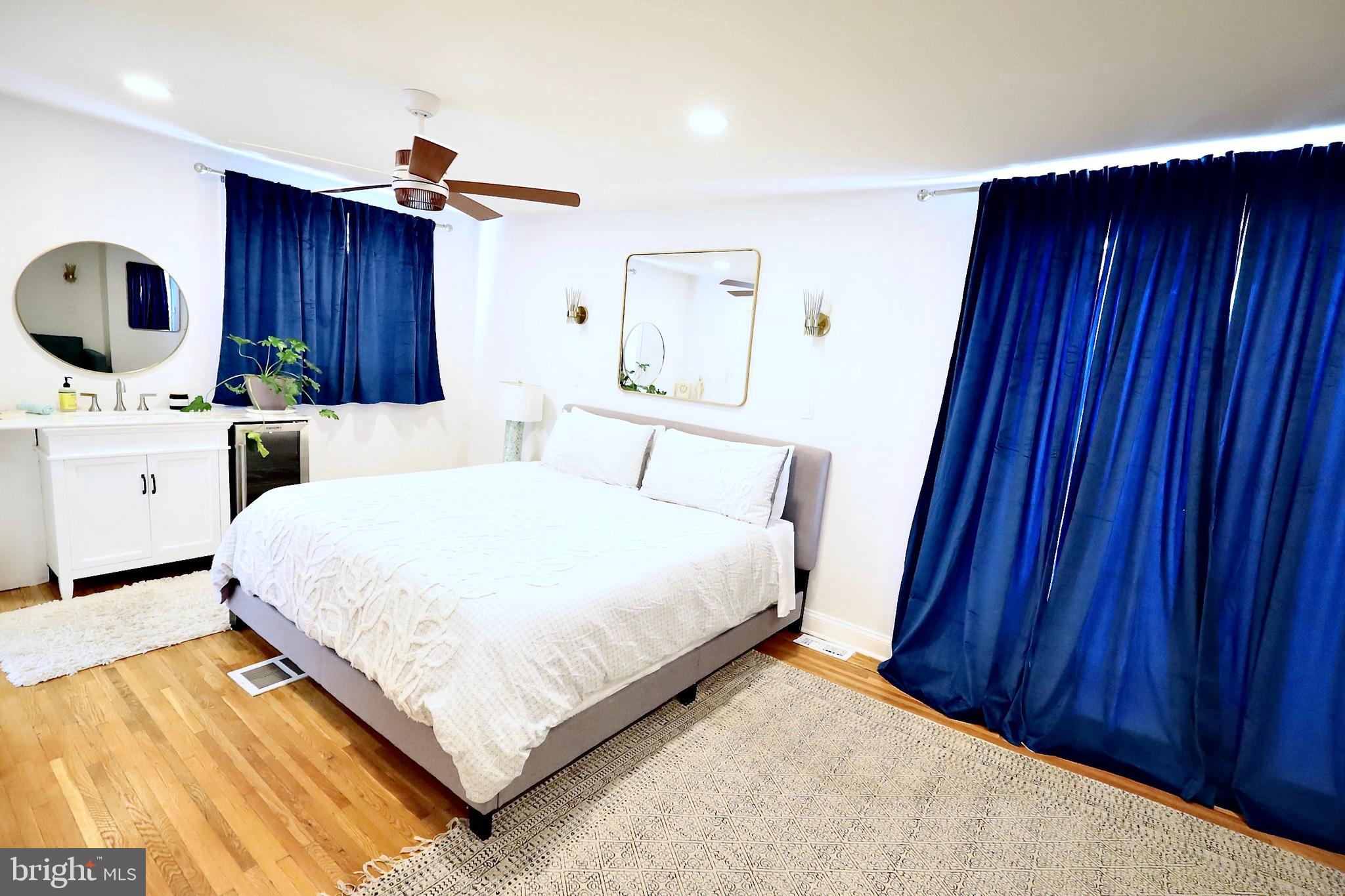 701 Lombard Street Philadelphia, PA 19147 - Photo 16 of 59 a bedroom with a bed and a dresser