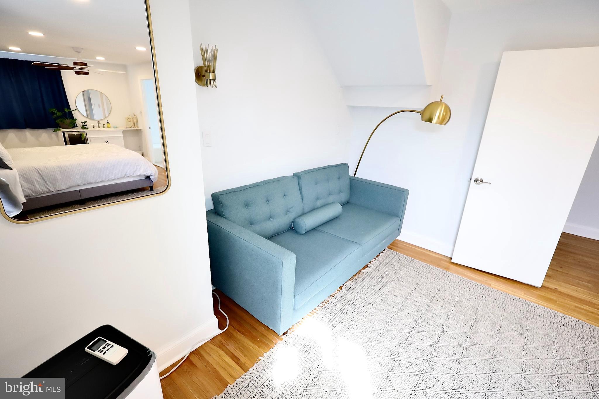 701 Lombard Street Philadelphia, PA 19147 - Photo 18 of 59 a living room with furniture and a wooden floor