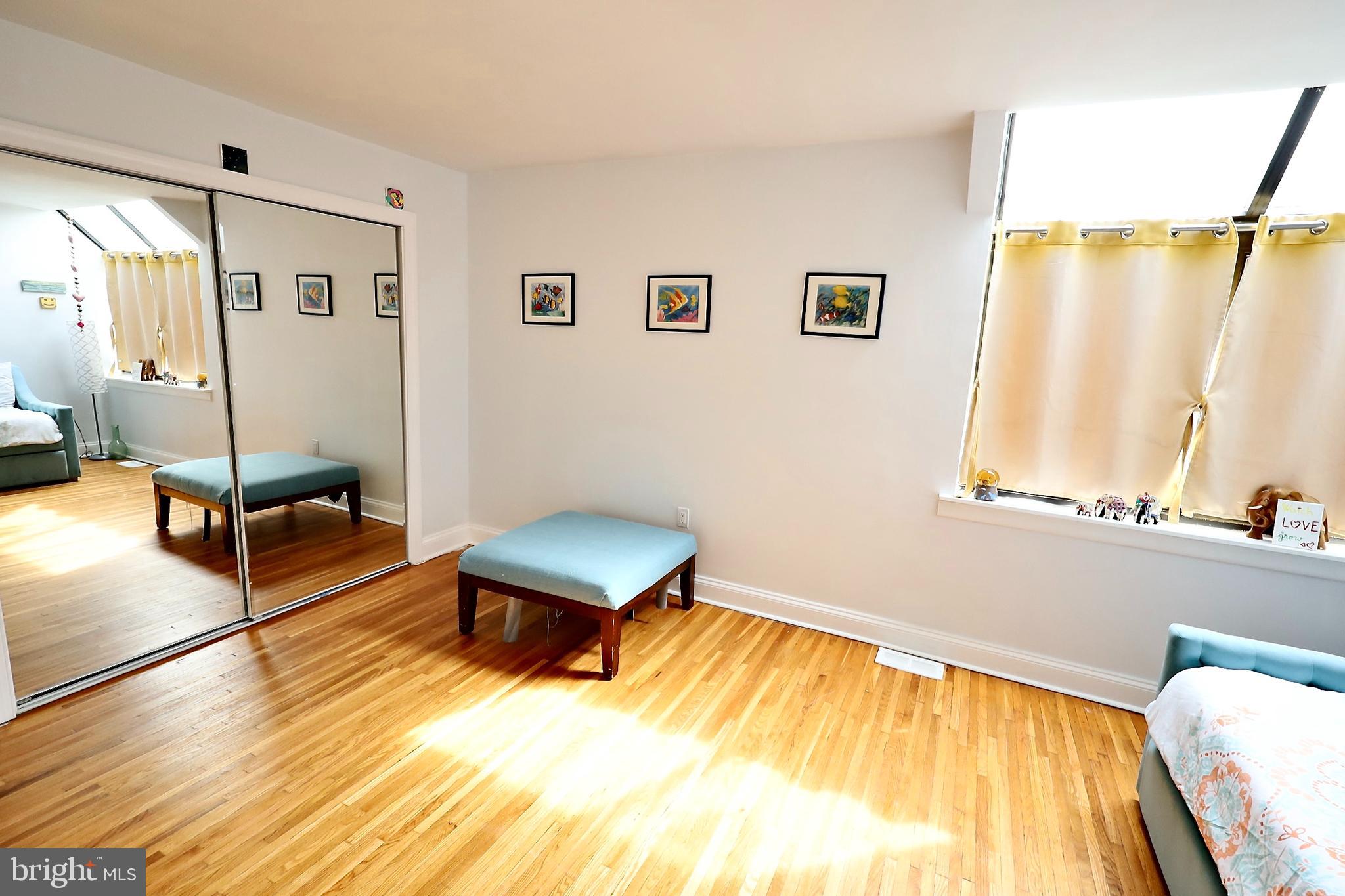 701 Lombard Street Philadelphia, PA 19147 - Photo 25 of 59 a living room with a bed furniture and a window