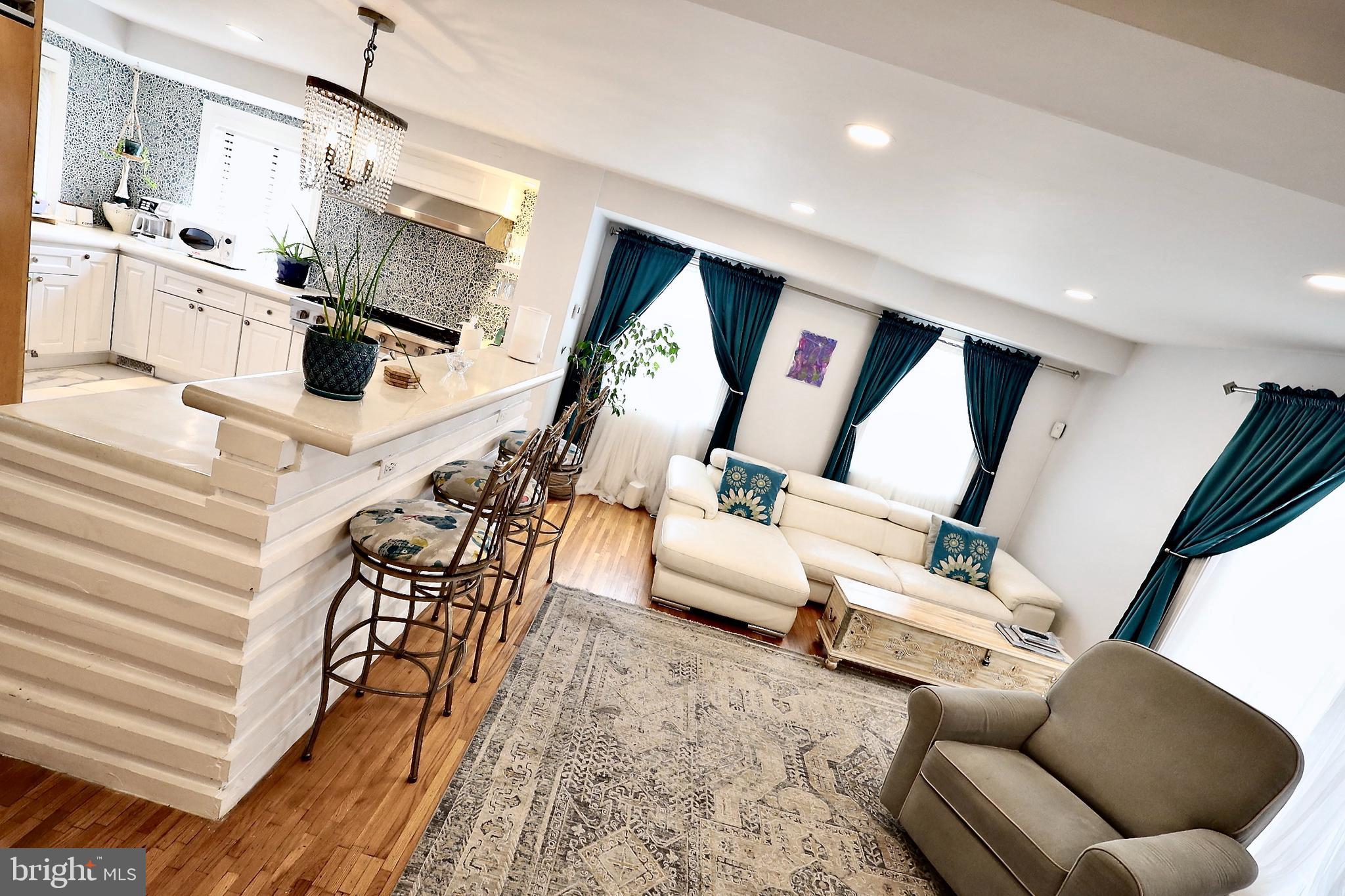 701 Lombard Street Philadelphia, PA 19147 - Photo 3 of 59 a living room with furniture and floor to ceiling window