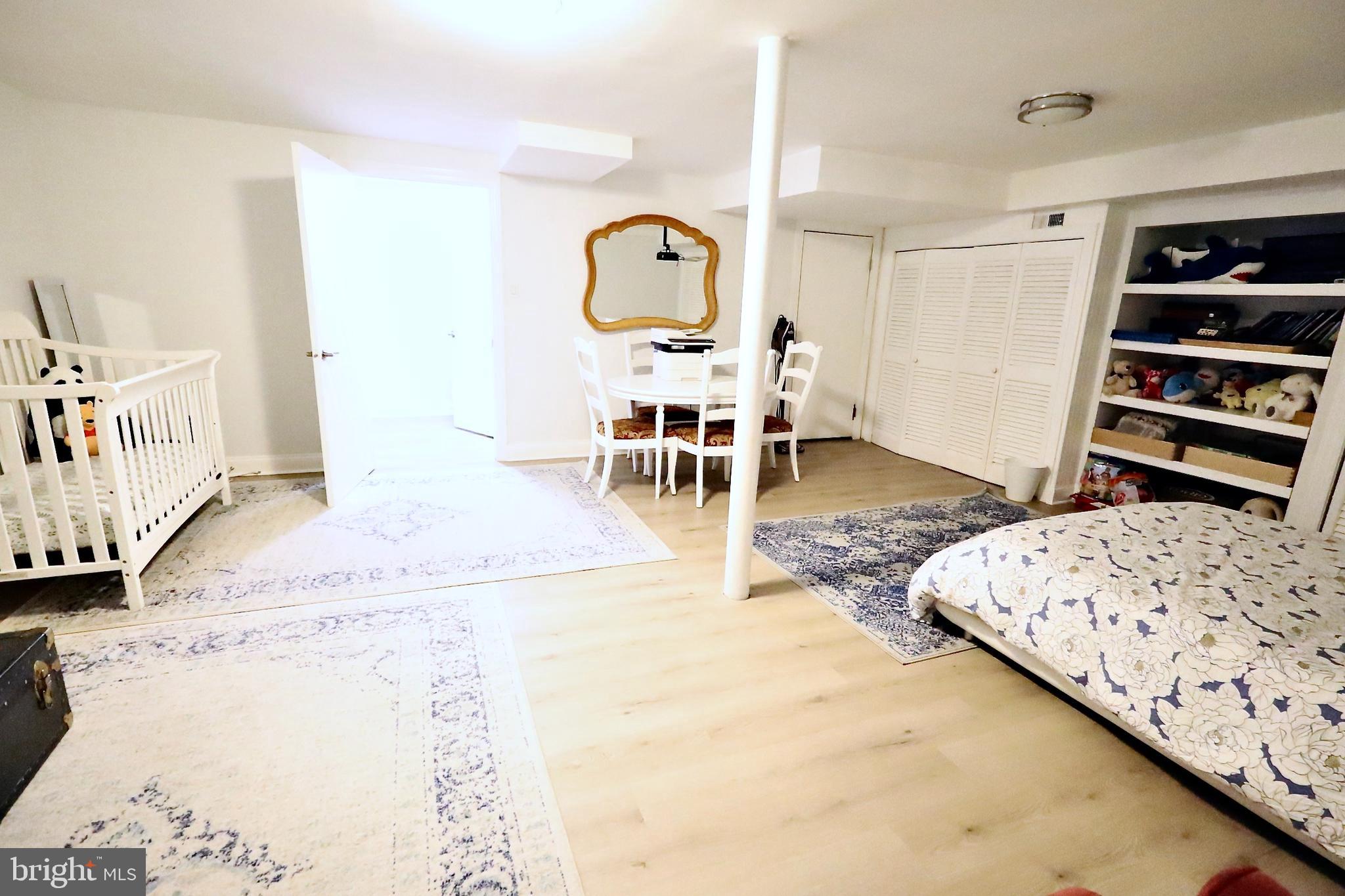 701 Lombard Street Philadelphia, PA 19147 - Photo 31 of 59 a living room with a bed furniture and a flat screen tv