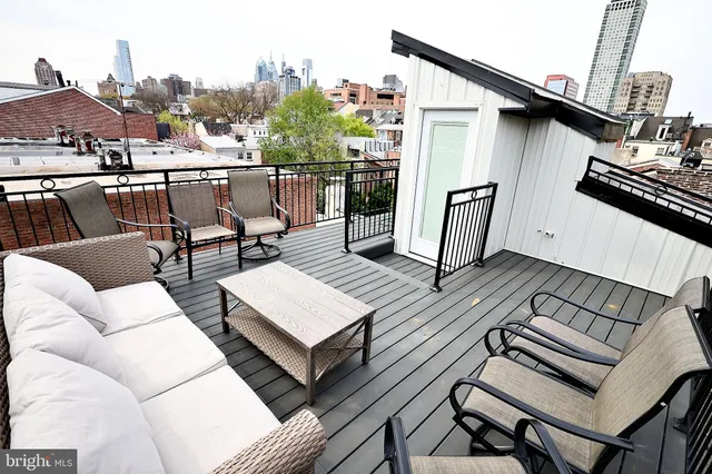 a view of a balcony with furniture