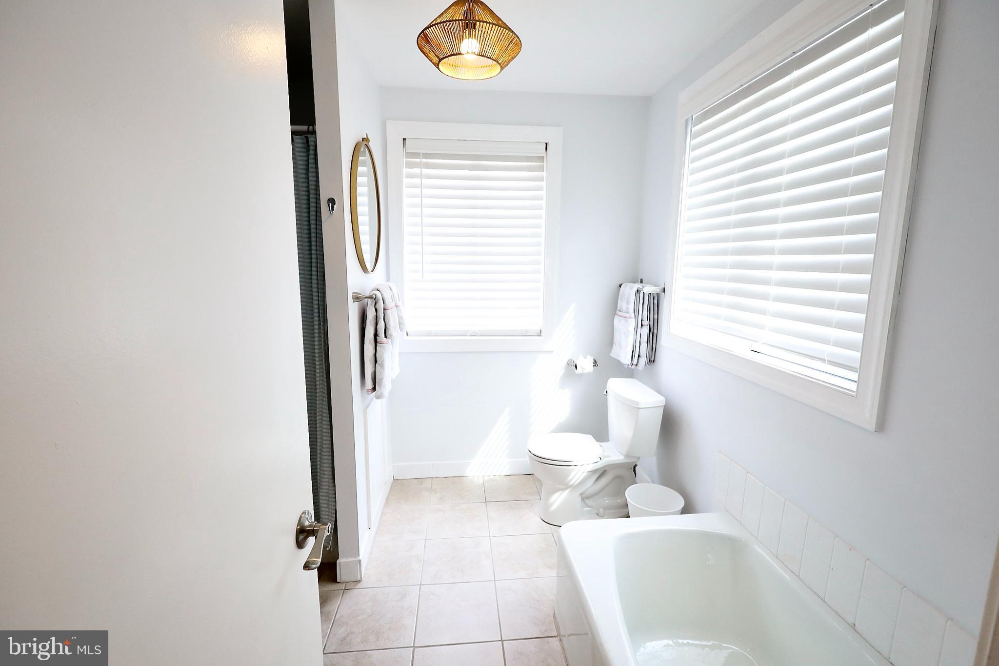 701 Lombard Street Philadelphia, PA 19147 - Photo 37 of 59 a bathroom with a toilet sink and a window