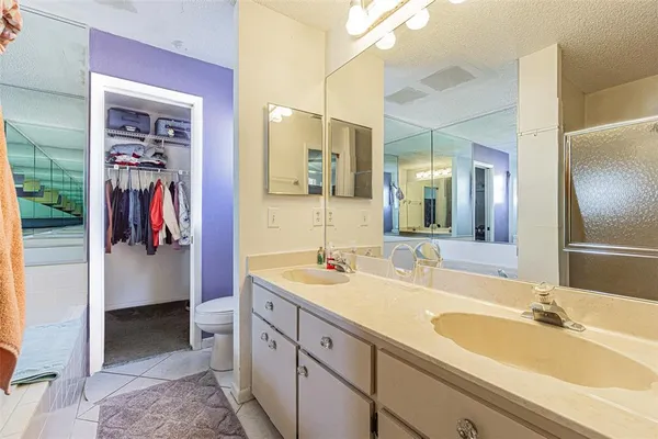 a spacious bathroom with a sink double vanity