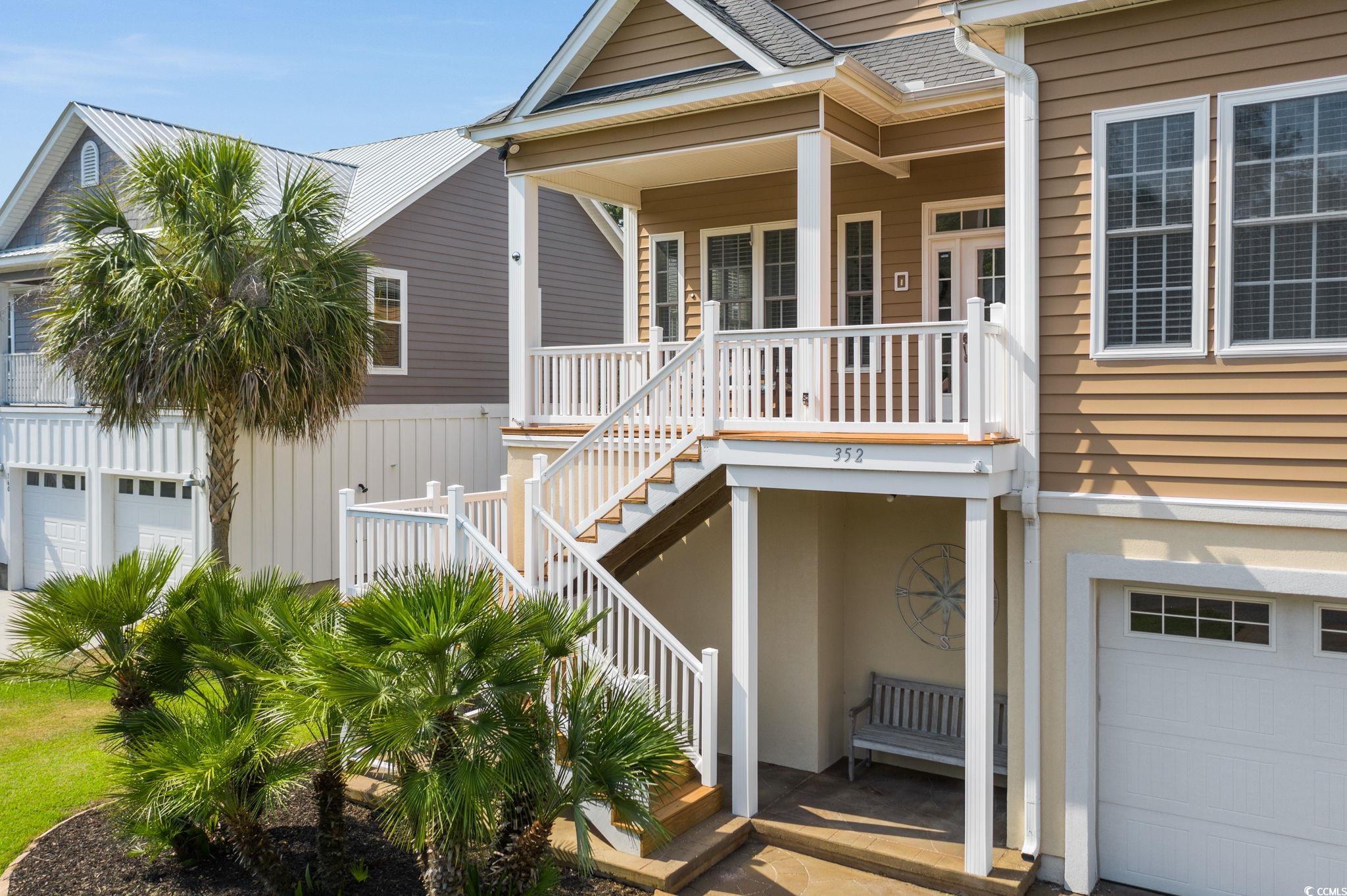 352 Sea Marsh Road Murrells Inlet, SC 29576 - Photo 3 of 39 View of front facade with a porch and a garage