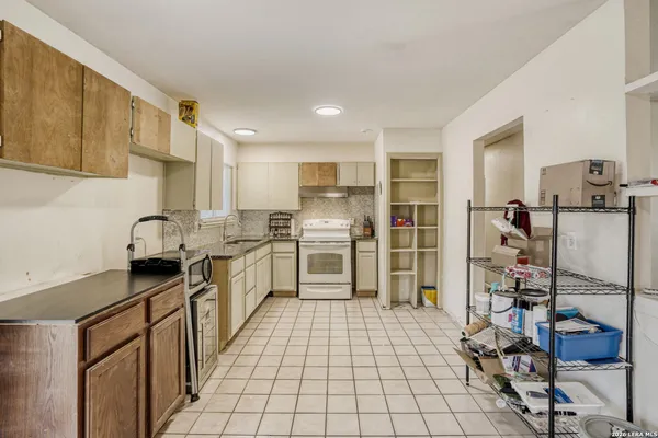 a kitchen with a sink and cabinets