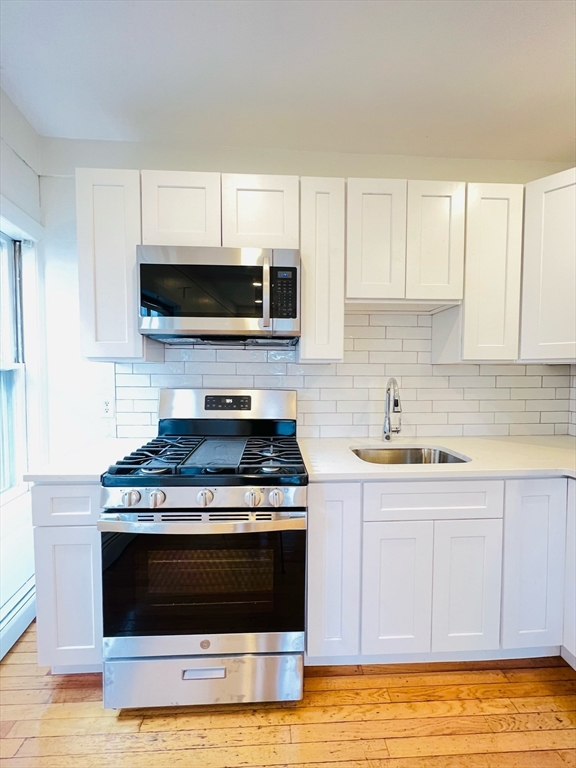 11 Franklin Street, Unit 3 Boston, MA 02129 - Photo 1 of 19 a kitchen with a stove and a sink