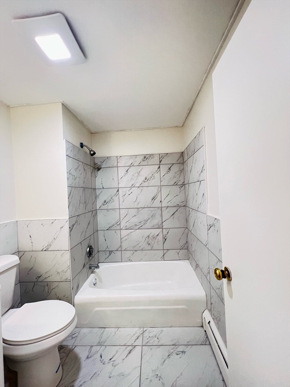 11 Franklin Street, Unit 3 Boston, MA 02129 - Photo 18 of 19 a bathroom with a bathtub and toilet