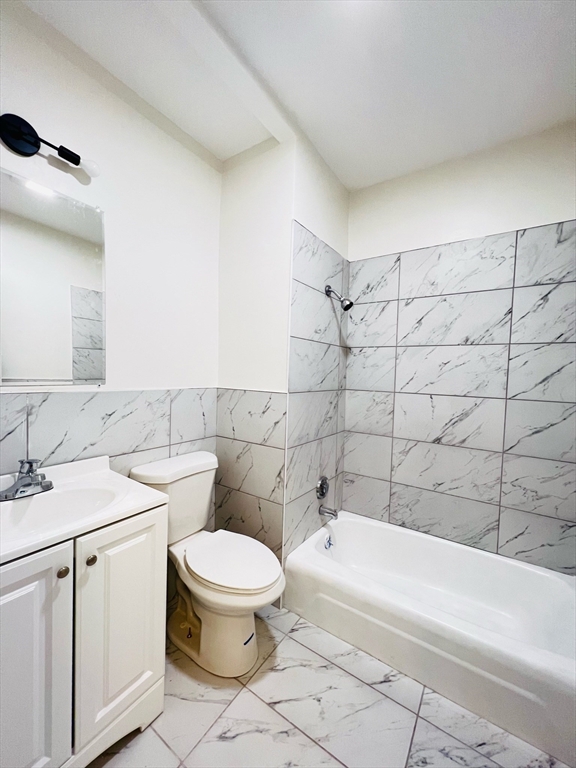11 Franklin Street, Unit 3 Boston, MA 02129 - Photo 19 of 19 a bathroom with a sink a toilet and shower