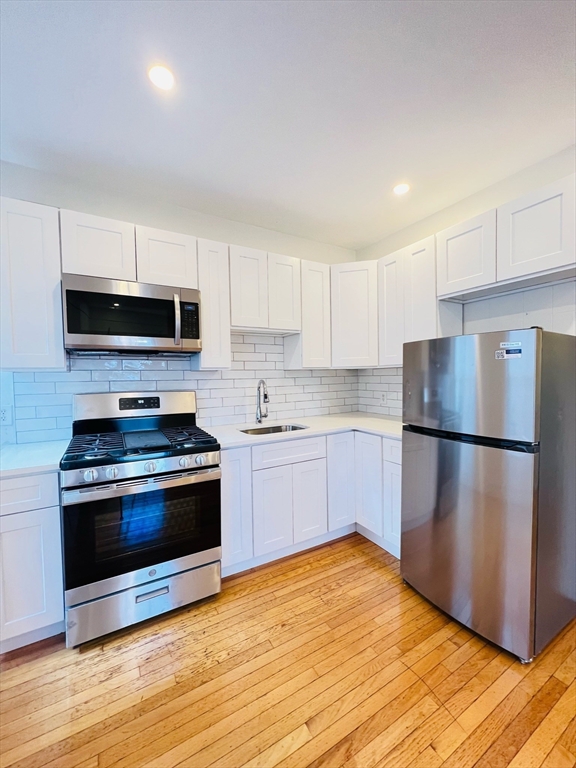 11 Franklin Street, Unit 3 Boston, MA 02129 - Photo 2 of 19 a kitchen with a refrigerator stove and microwave