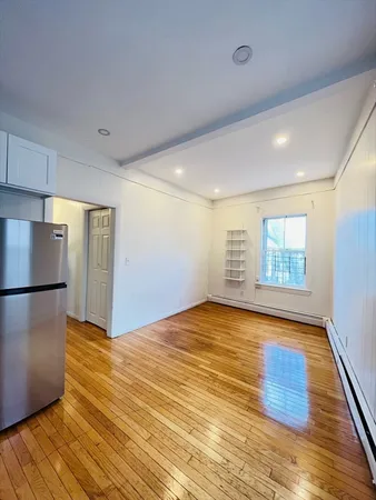 a view of a livingroom with wooden floor