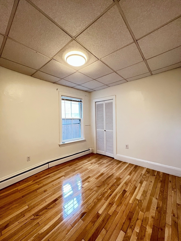11 Franklin Street, Unit 3 Boston, MA 02129 - Photo 9 of 19 a view of room with window and wooden floor
