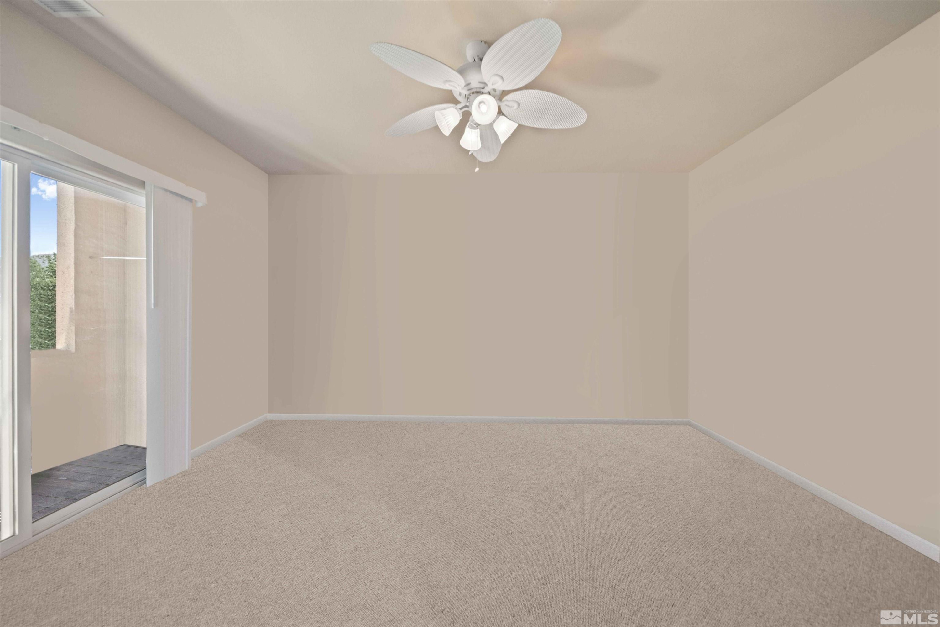 17000 Wedge Parkway Reno, NV 89511 - Photo 16 of 35 an empty room with a chandelier fan and windows