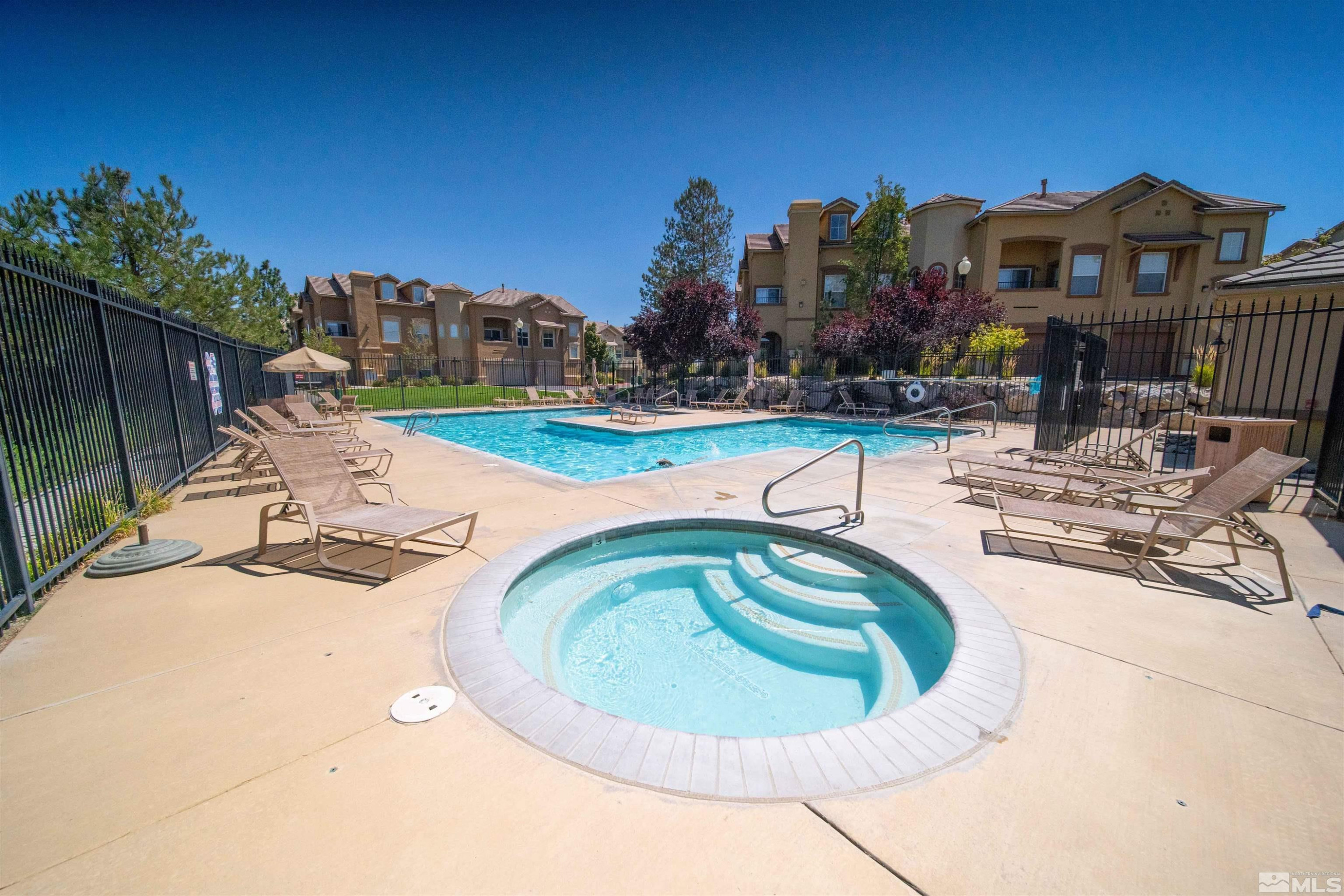 17000 Wedge Parkway Reno, NV 89511 - Photo 29 of 35 a view of a swimming pool with outdoor seating and plants