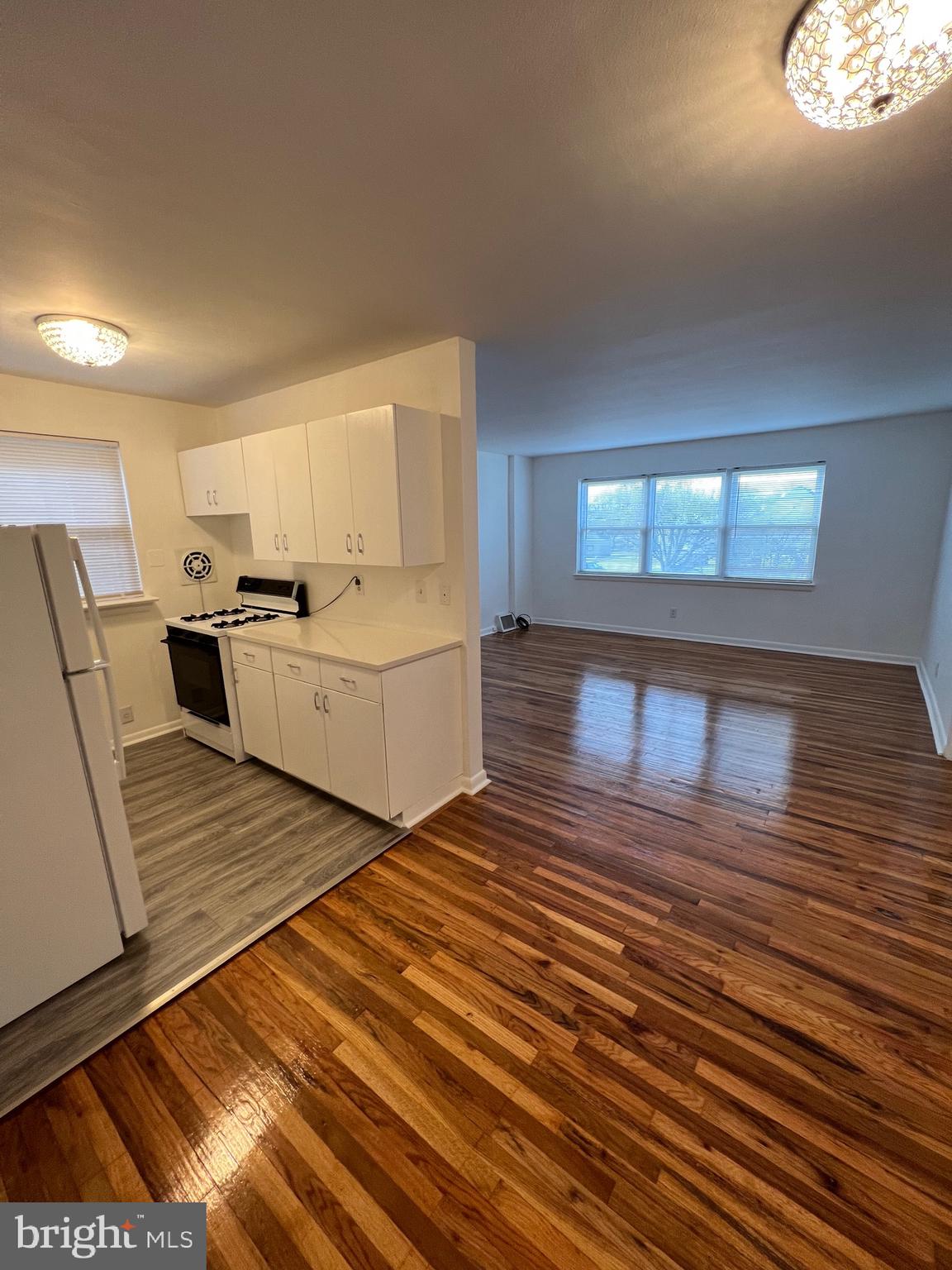 112 Clement Road, Unit B Oreland, PA 19075 - Photo 7 of 19 a room with a couch and a stove top oven