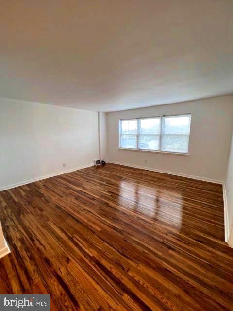 112 Clement Road, Unit B Oreland, PA 19075 - Photo 8 of 19 a view of empty room with wooden floor and fan