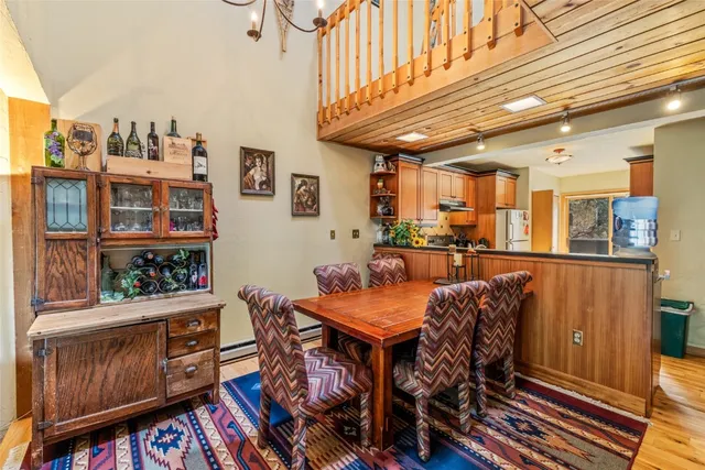 a view of a dining area with furniture and wooden floor