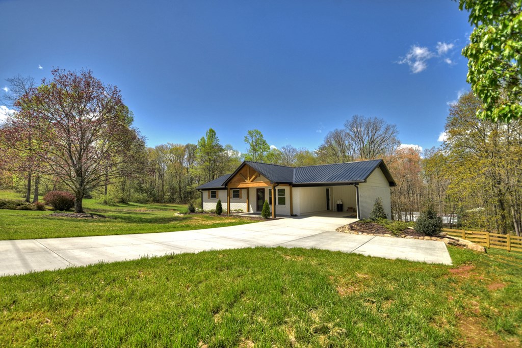 975 Goss Road Epworth, GA 30541 - Photo 24 of 58 a front view of a house with a yard