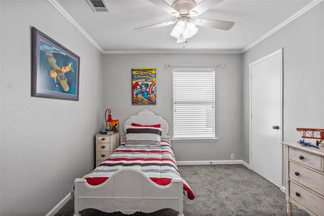 a room that has a bed and a chandelier