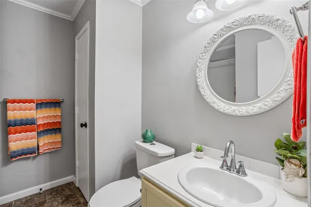 a bathroom with a toilet and a sink