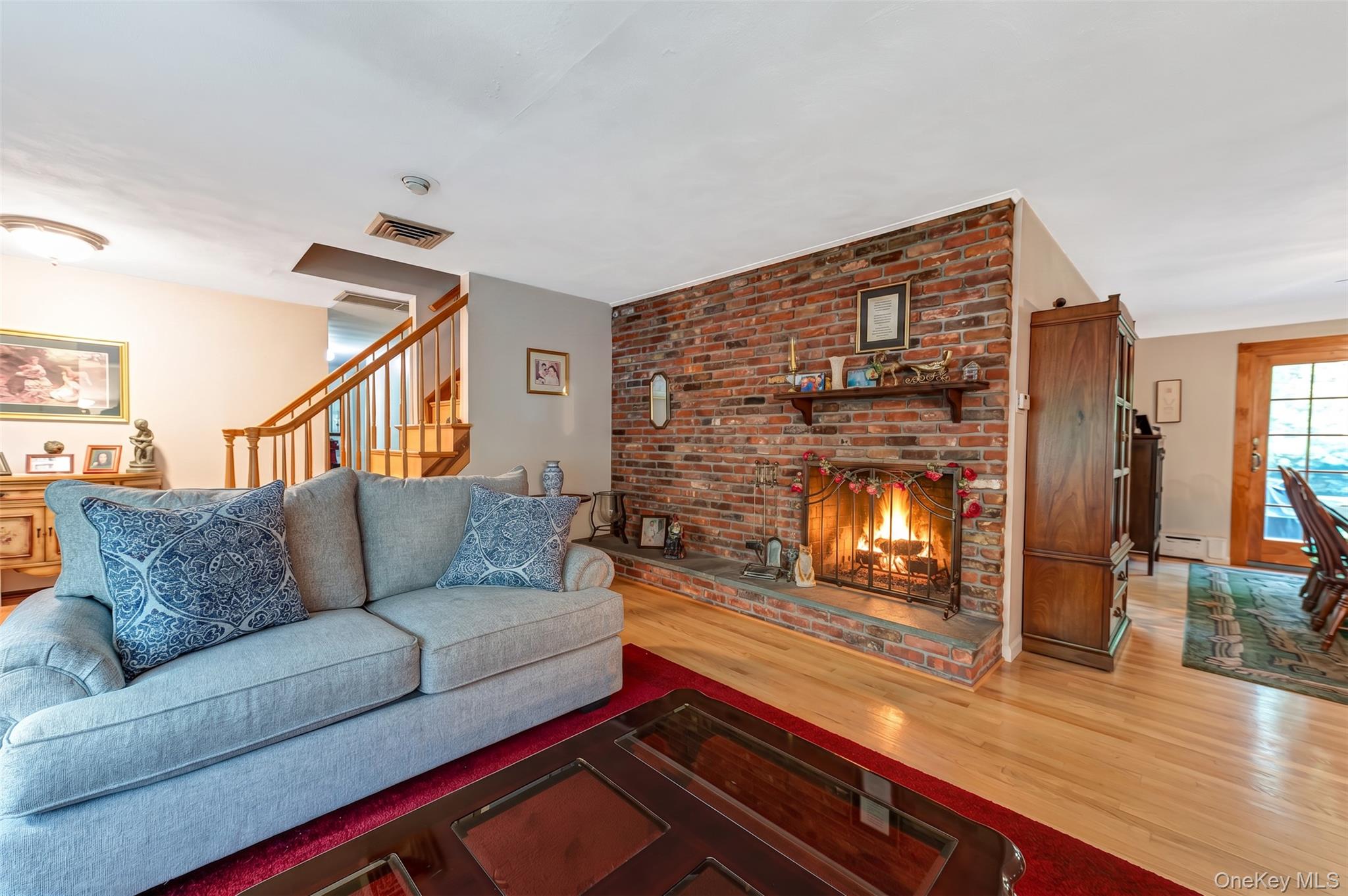 118 Harbor Road St. James, NY 11780 - Photo 2 of 18 dual fireplace in living room / kitchen