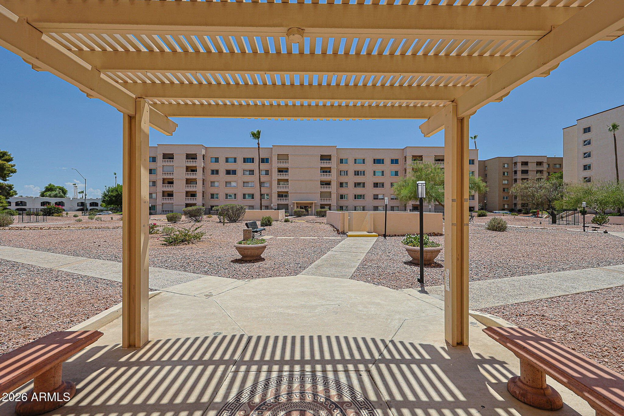 7920 East Camelback Road, Unit 111 Scottsdale, AZ 85251 - Photo 3 of 32 a view of a terrace with wooden floor