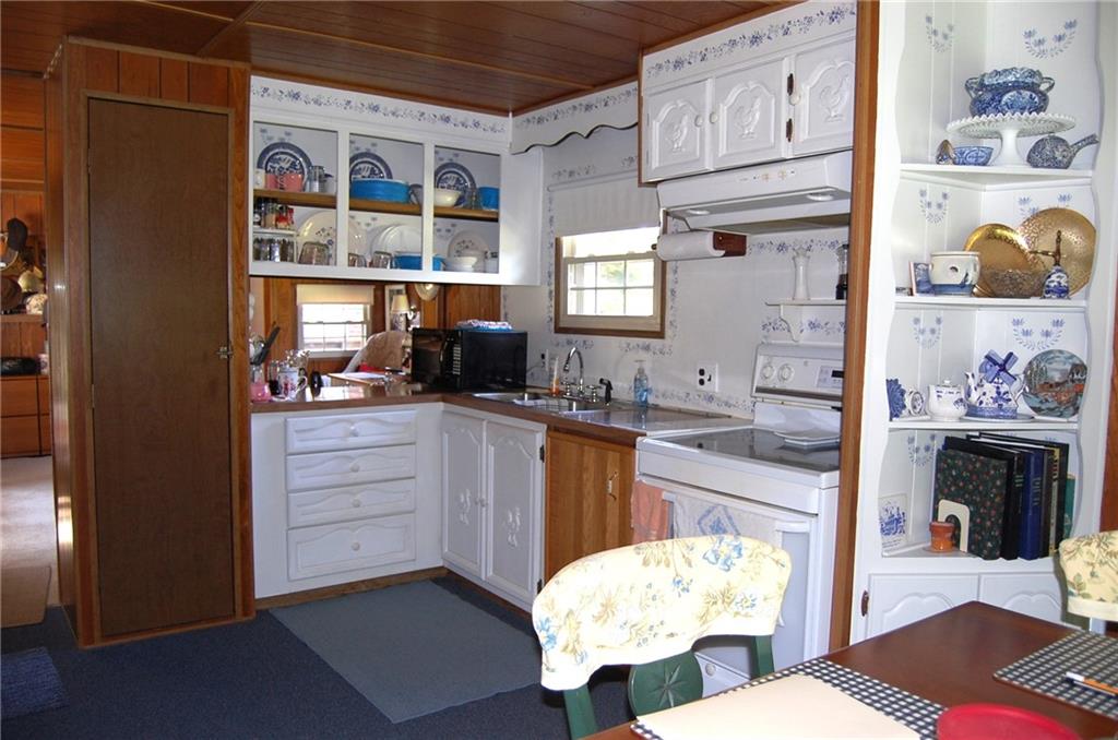 124 Gun Hill Road Wind Ridge, PA 15380 - Photo 18 of 25 a kitchen with a sink cabinets and window
