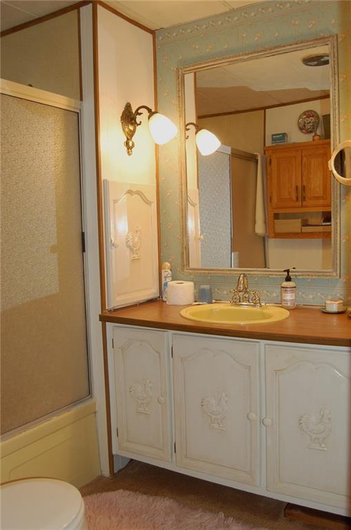 124 Gun Hill Road Wind Ridge, PA 15380 - Photo 20 of 25 a bathroom with a granite countertop sink mirror vanity and toilet