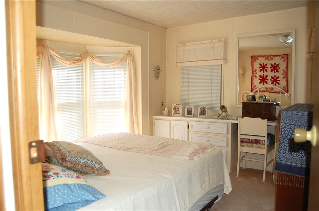 124 Gun Hill Road Wind Ridge, PA 15380 - Photo 21 of 25 a bedroom with a bed and a window