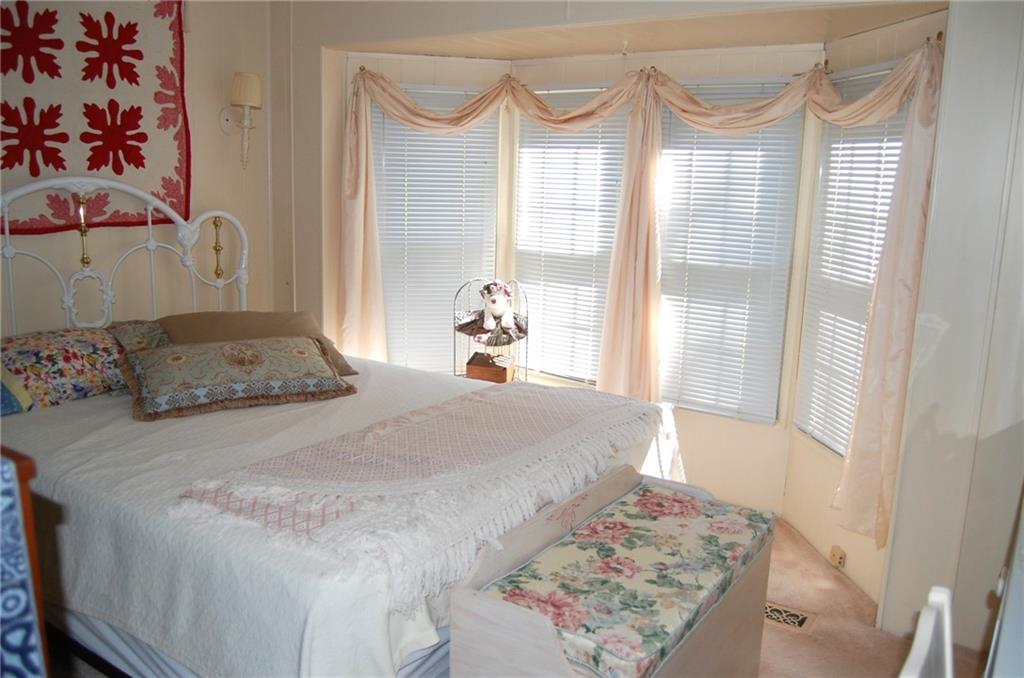 124 Gun Hill Road Wind Ridge, PA 15380 - Photo 22 of 25 a bedroom with a bed and a window