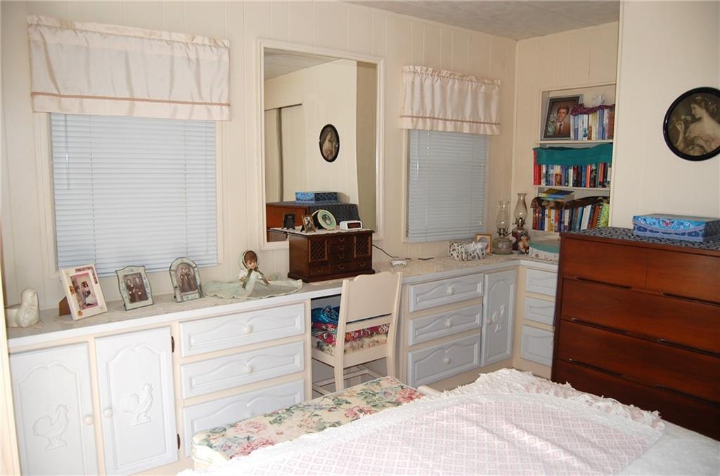 124 Gun Hill Road Wind Ridge, PA 15380 - Photo 23 of 25 a room with a chair and a dresser in it