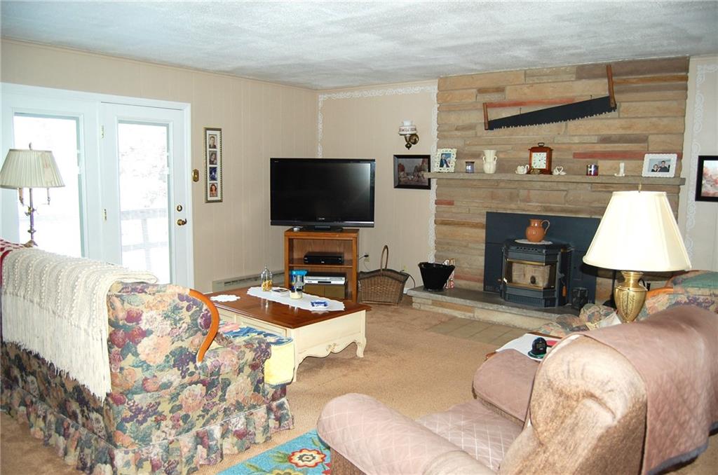 124 Gun Hill Road Wind Ridge, PA 15380 - Photo 10 of 25 a bedroom with a bed and a flat screen tv