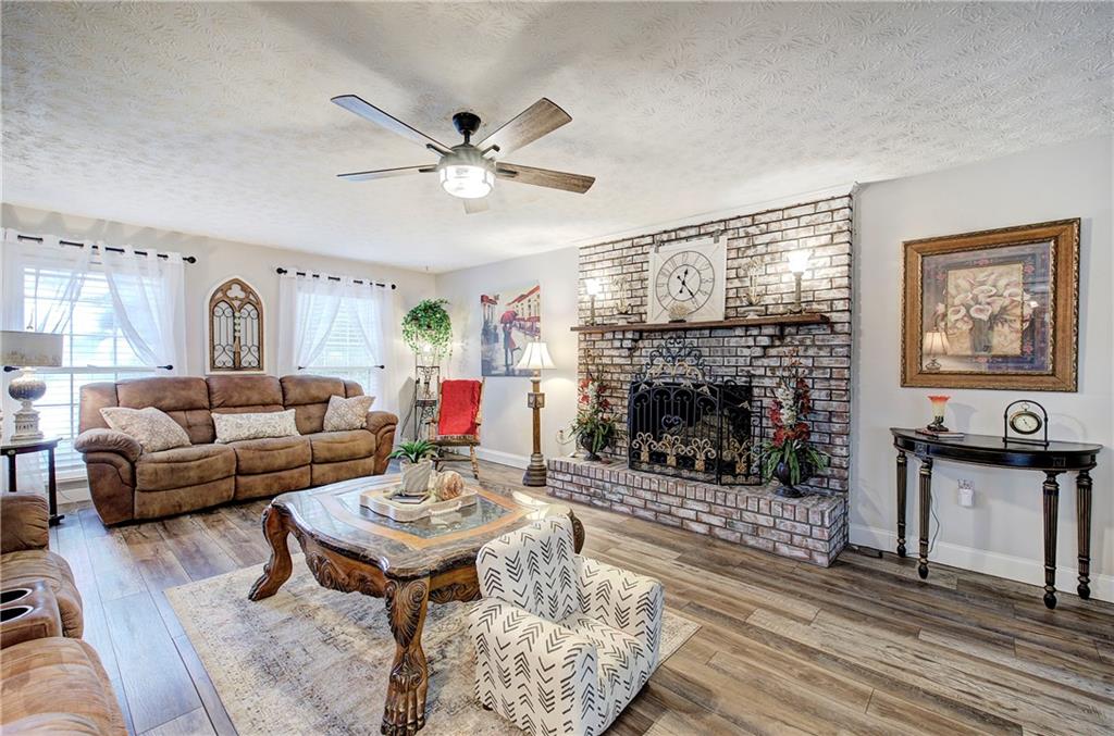 3637 Nebo Road Hiram, GA 30141 - Photo 17 of 63 a living room with furniture a fireplace and a table