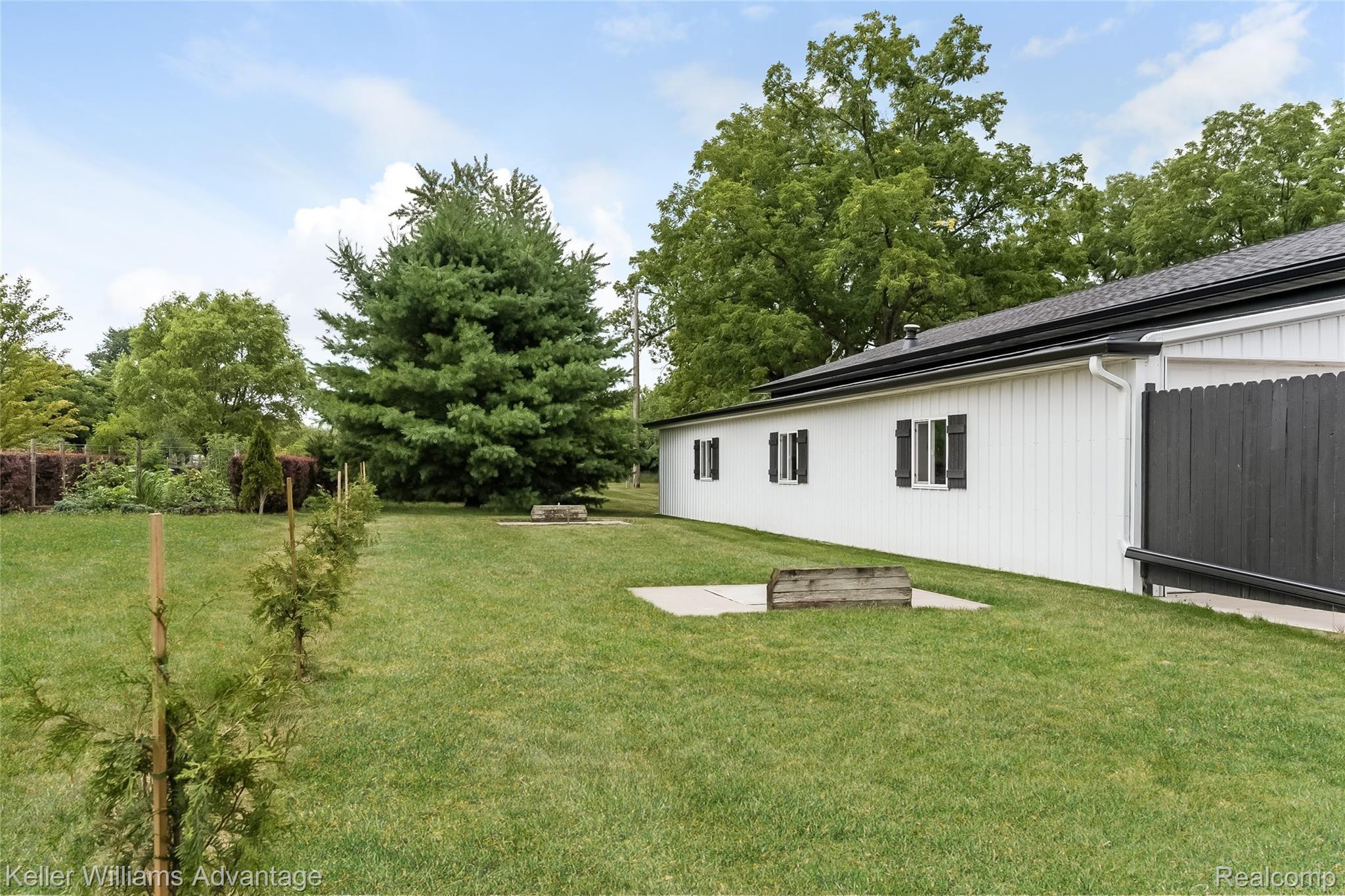 5385 Mack Road Howell, MI 48855 - Photo 53 of 59 Horseshoe pit behind pole barn and pole barn addition.