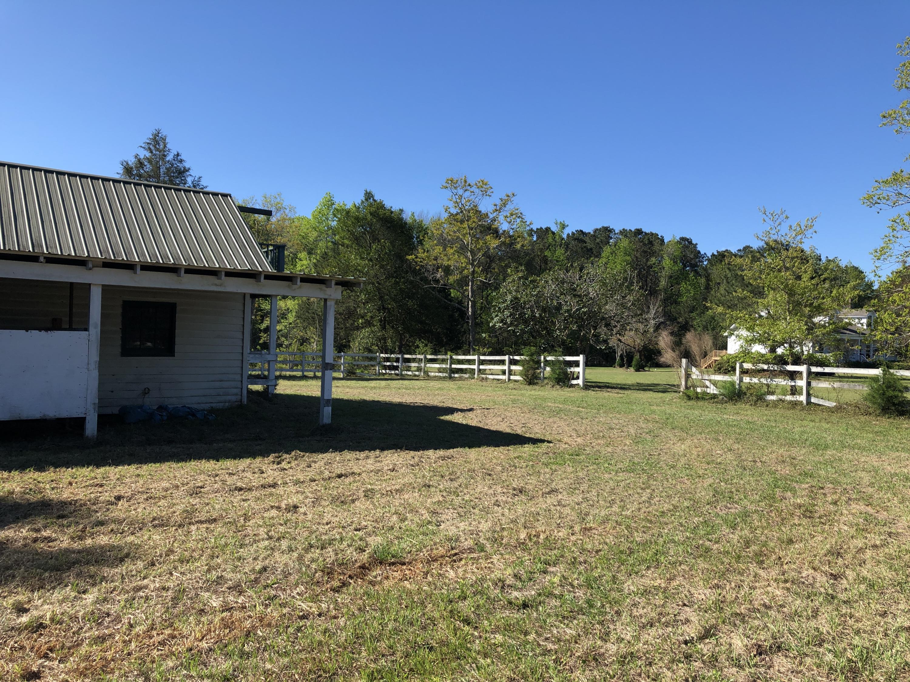 4911 Seewee Road Awendaw, SC 29429 - Photo 14 of 19 Stable front right towards neighbor h