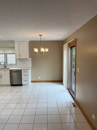a view of a kitchen with microwave and cabinets