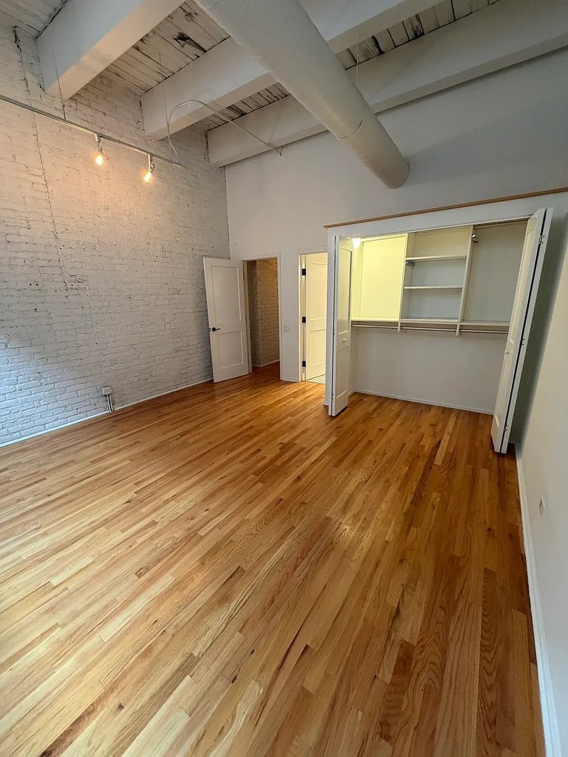 312 North May Street, Unit 4H Chicago, IL 60607 - Photo 9 of 13 a view of empty room with wooden floor