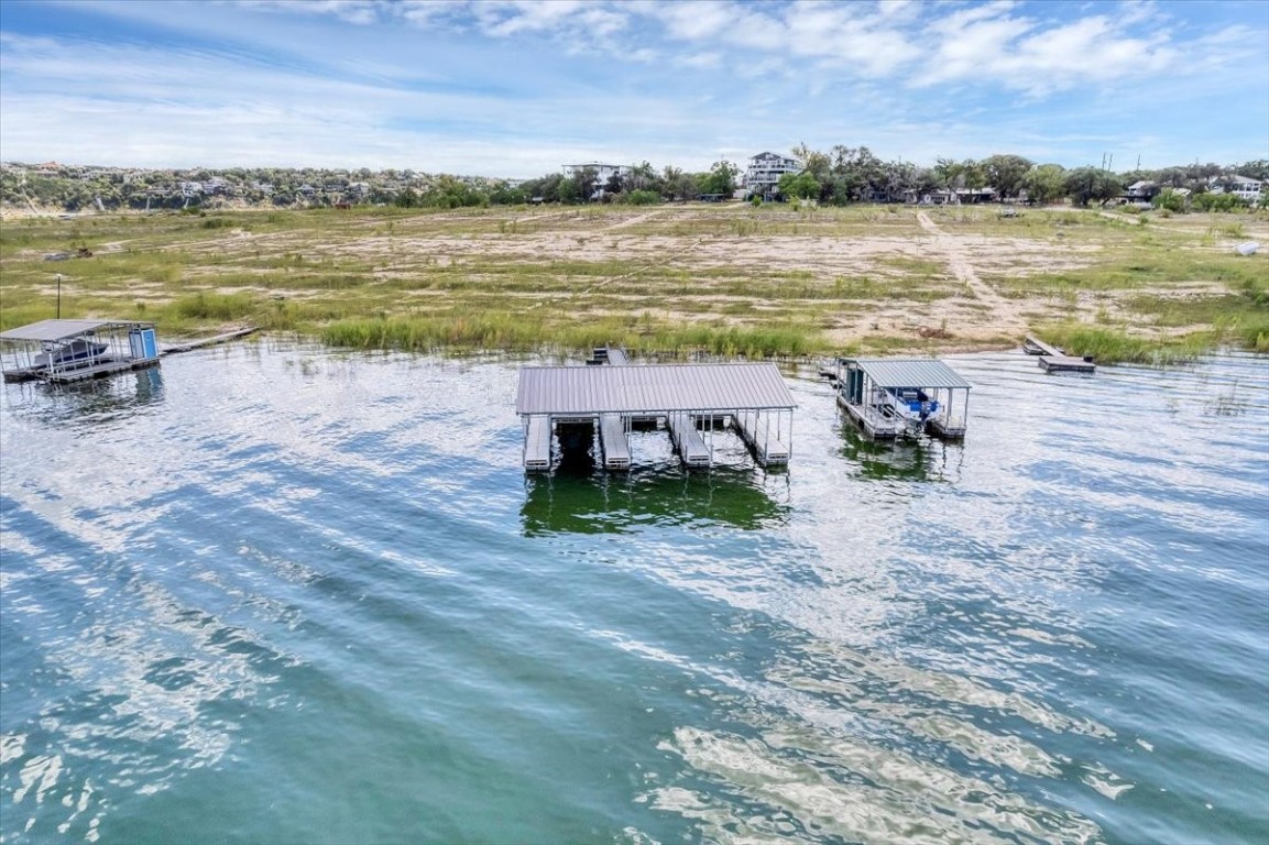 1519 Chipmunk Road Austin, TX 78734 - Photo 3 of 20 a view of a lake with a yard