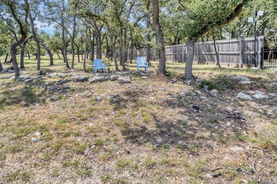 1519 Chipmunk Road Austin, TX 78734 - Photo 9 of 20 a backyard of a house with table and chairs
