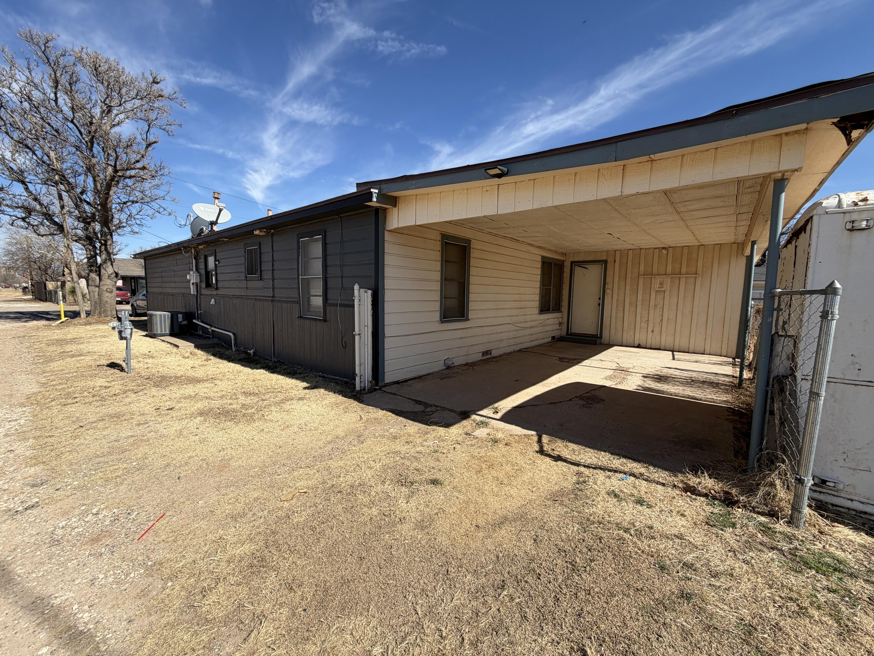 1705 West 16th Street Plainview, TX 79072 - Photo 12 of 13 a view of a house with a yard