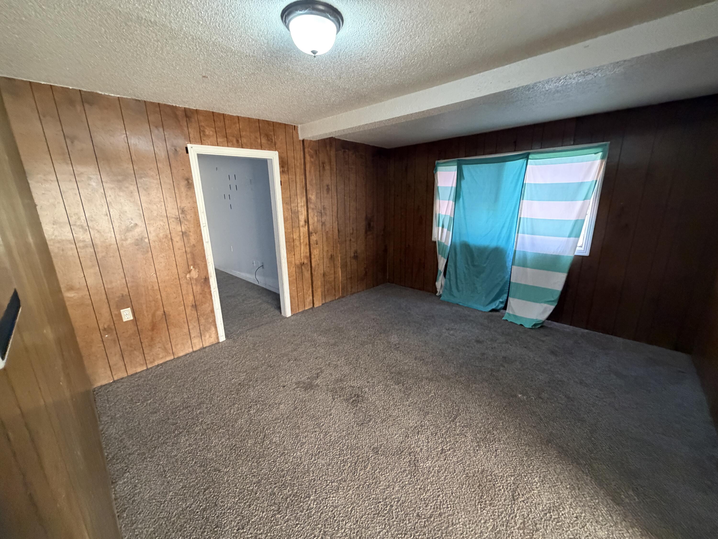 1705 West 16th Street Plainview, TX 79072 - Photo 4 of 13 a view of an empty room with a fireplace
