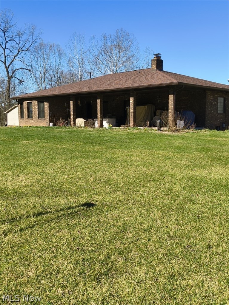 10174 Veto Road Belpre, OH 45714 - Photo 10 of 45 Back of house and a patio area.