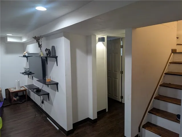 a view of a hallway with workspace and closet