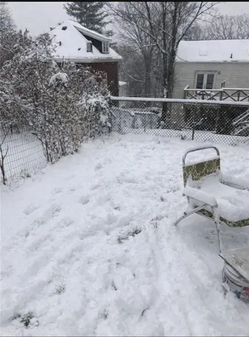 a view of a yard with a snow