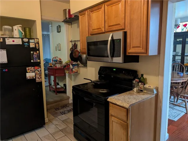 a kitchen with a stove and a microwave
