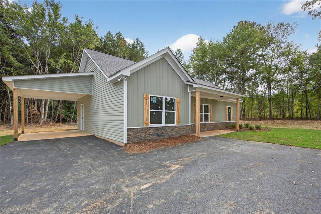 466 Mt Zion Church Road Tallapoosa, GA 30176 - Photo 14 of 35 a view of a house with a yard and large tree