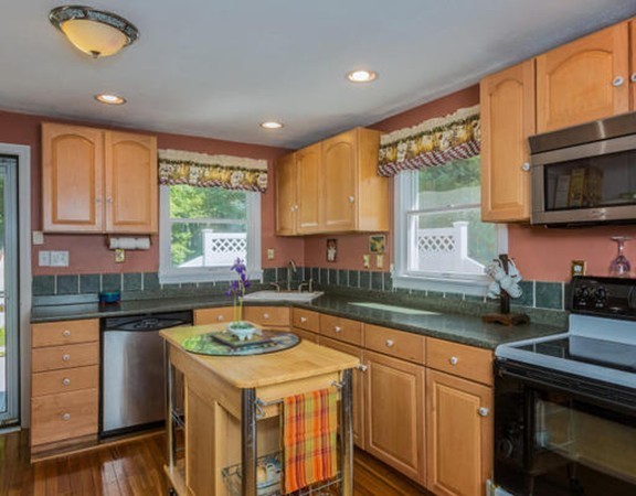 57 Boxford Road Ipswich, MA 01938 - Photo 7 of 30 a kitchen that has a sink and a stove in it
